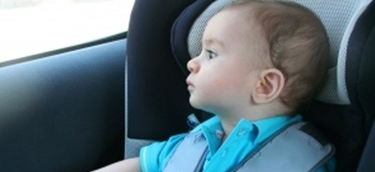a baby at the back seat of the car