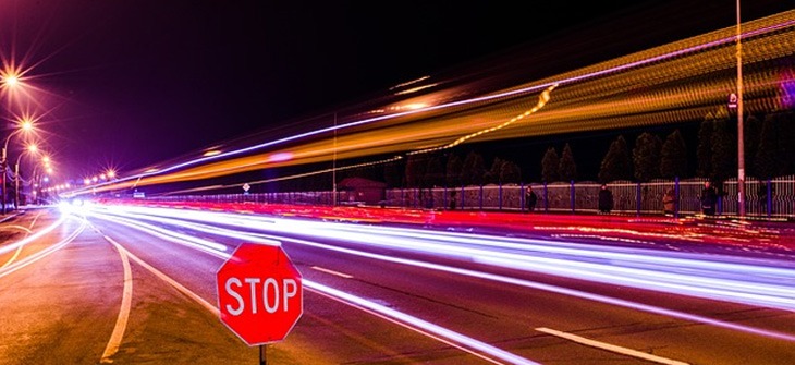 cars speeding through the highway