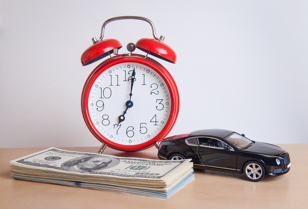 Alarm Clock Car And Money Car Accident claim concept