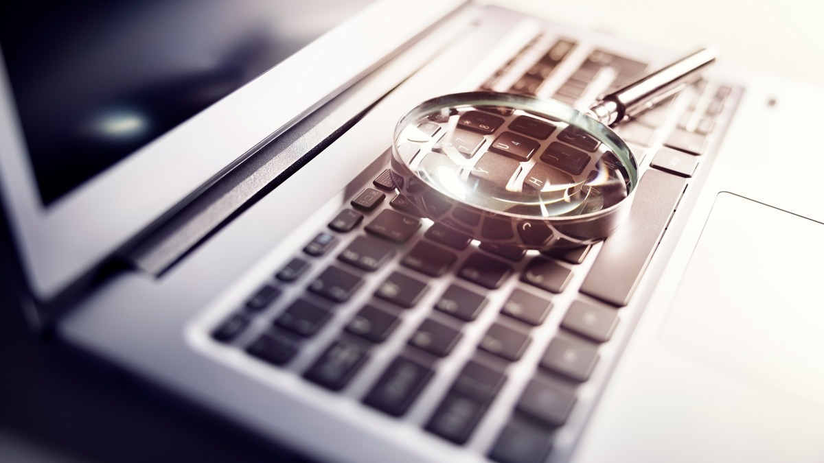 Magnifying-glass-on-top-of-laptop-keyboard