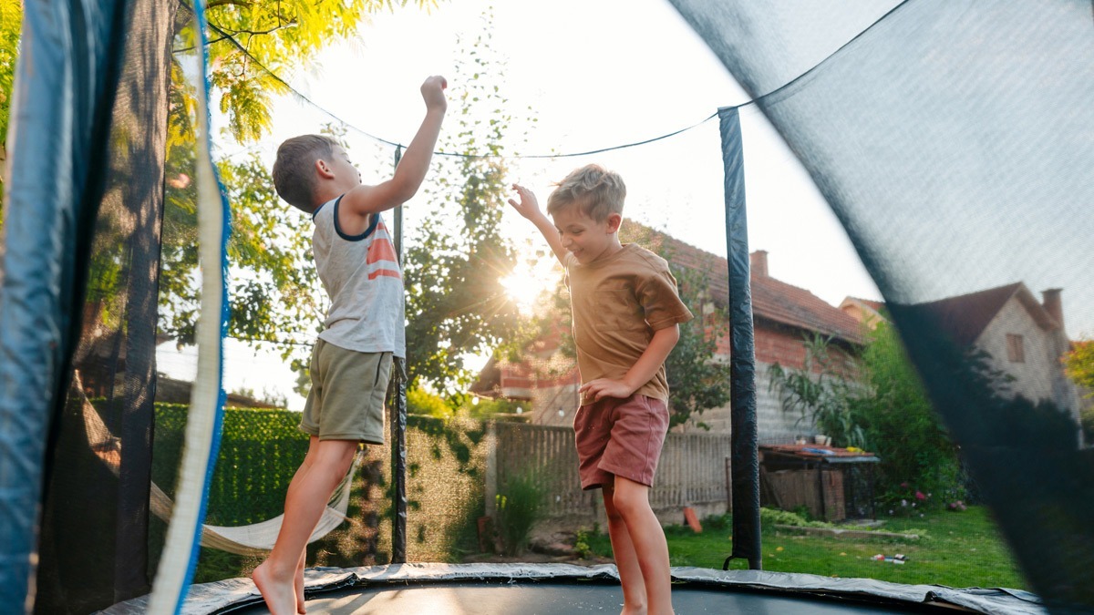 two-boys-on-a-backyard-trampoline