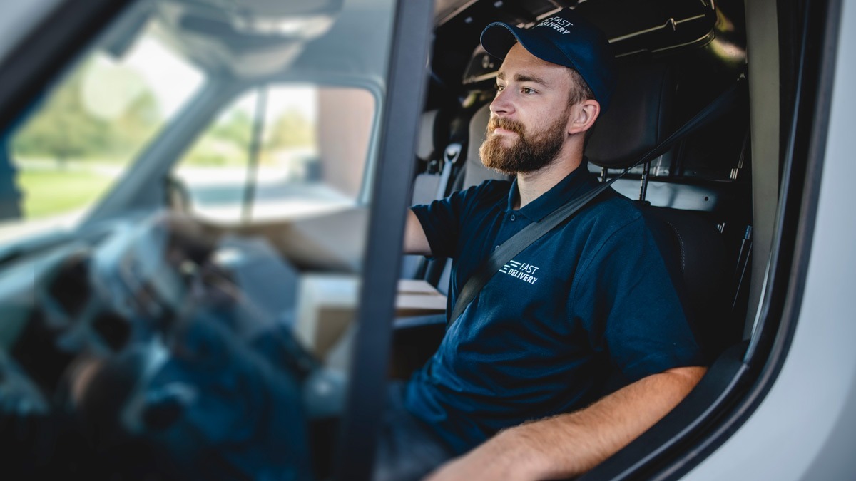 worker-driving-in-company-van
