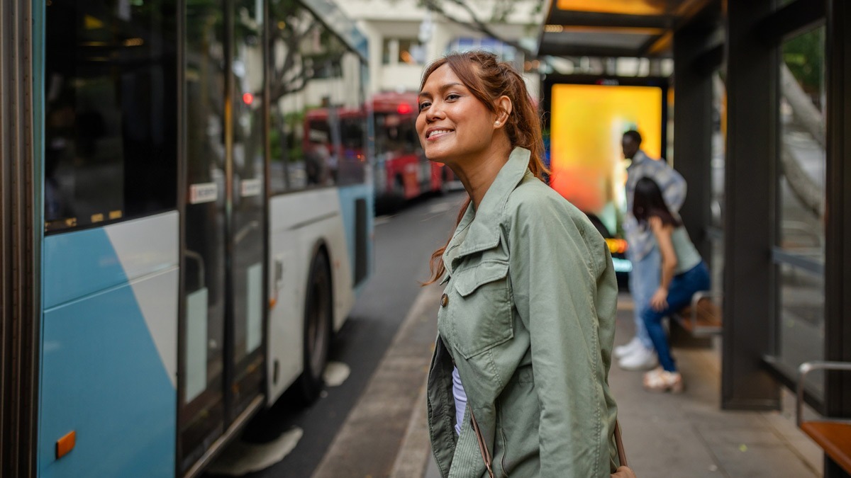 young-woman-waiting-to-board-bus