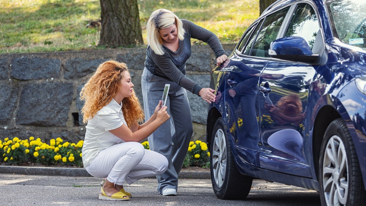 drivers-look-at-damage-after-accident