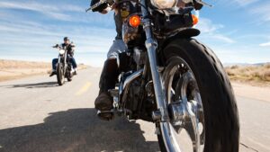 two-motorcycle-riders-on-road