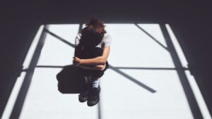 withdrawn-person-sitting-alone