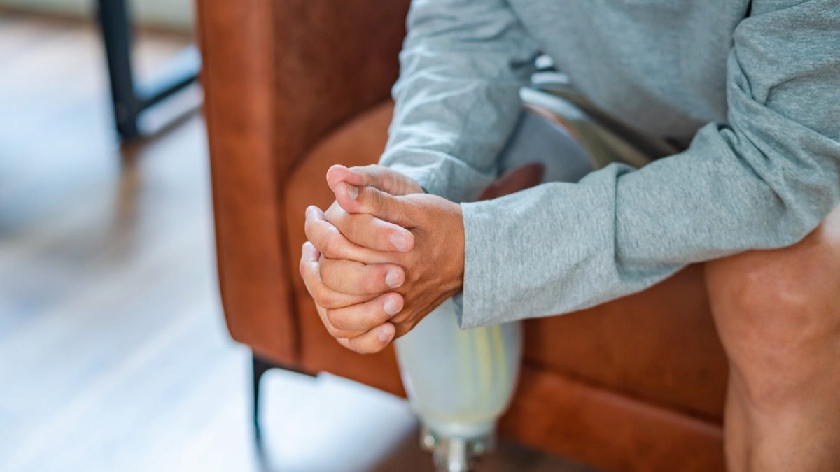 man-seated-with-prosthetic-leg