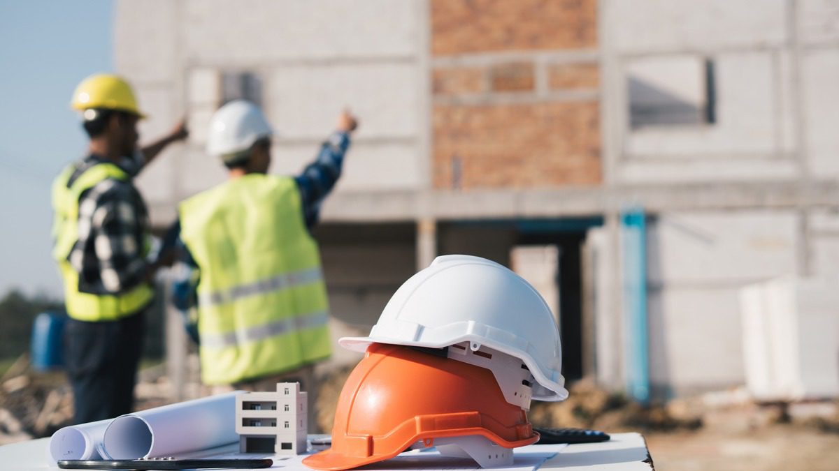 construction-workers-with-hard-hats-in-foreground