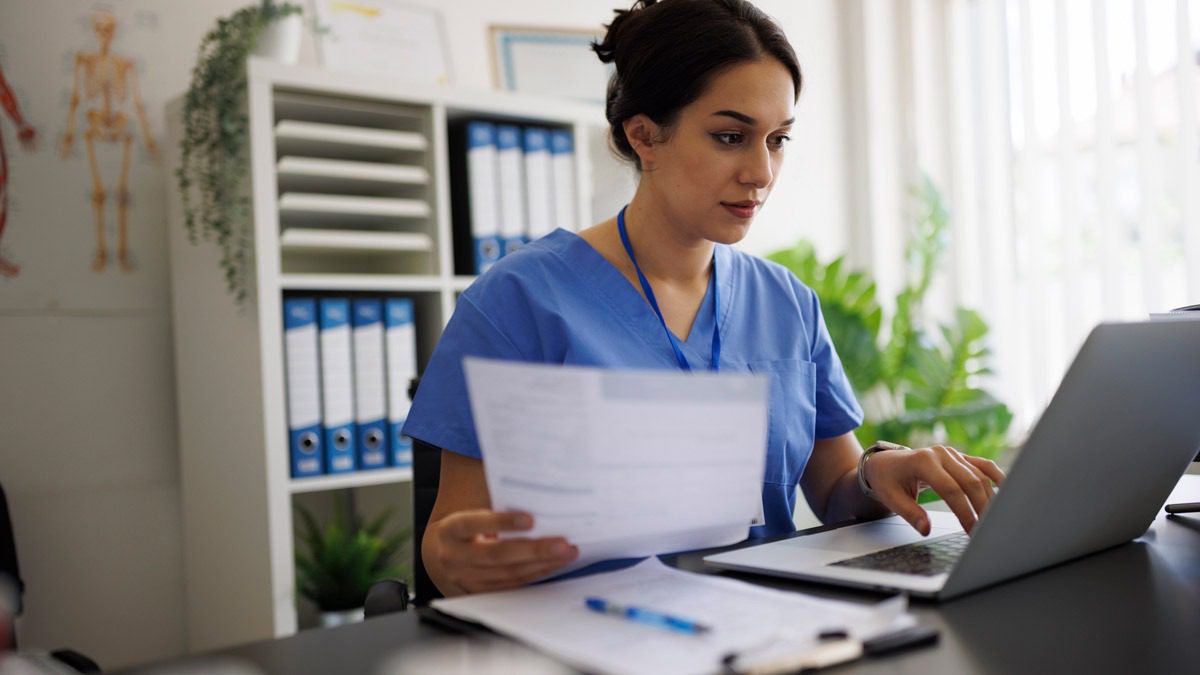 medical-worker-reviewing-bills-in-office