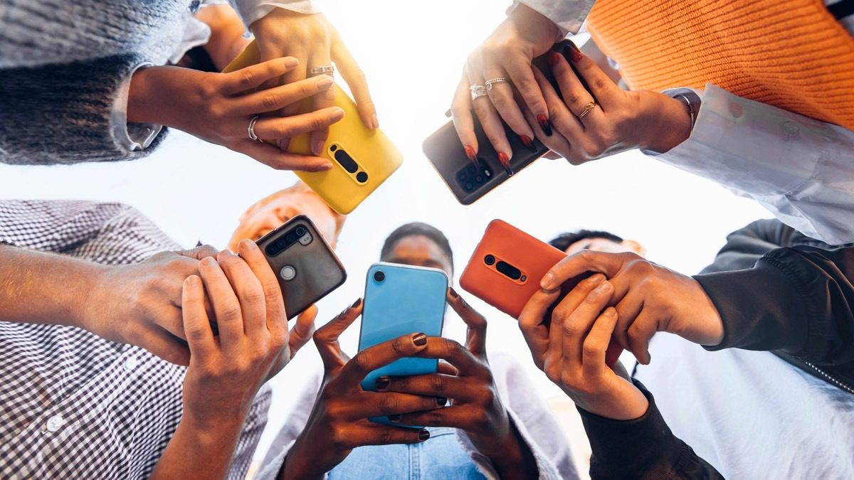 view-from-below-group-holding-cell-phones