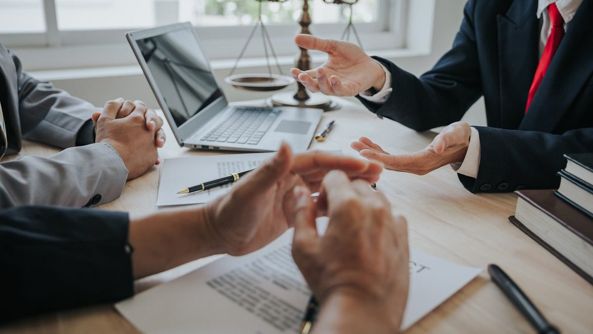 Businessmen-and-lawyers-discuss-contract-documents