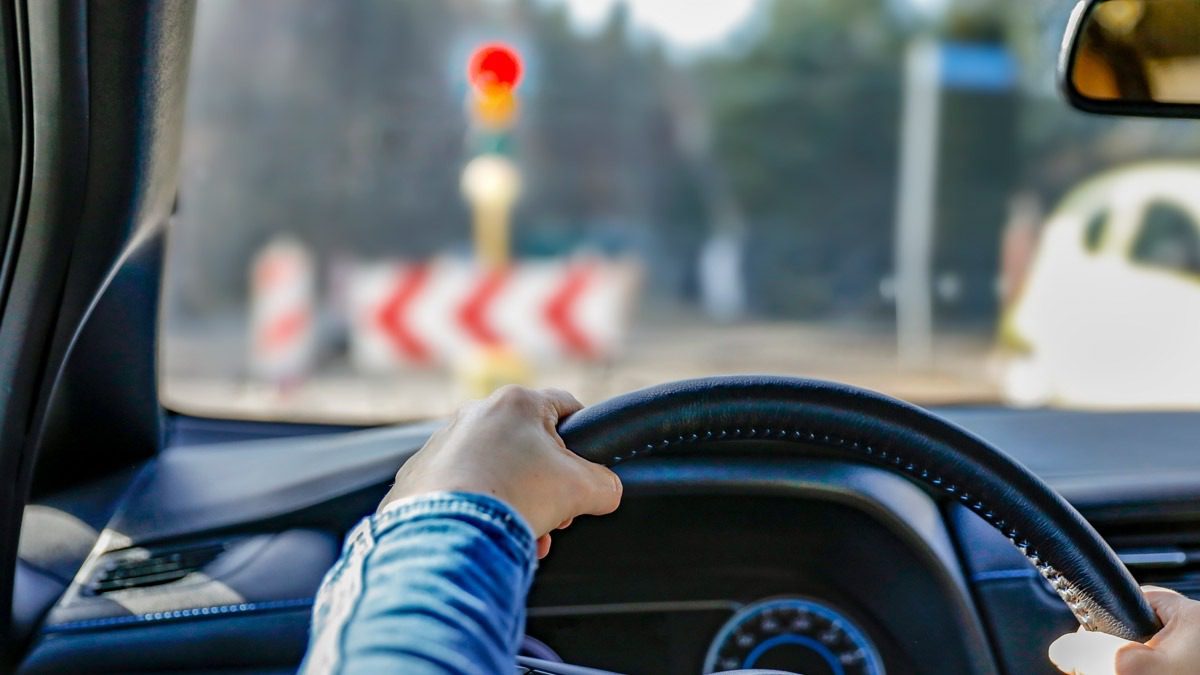 view-from-drivers-seat-of-driver-holding-steering-wheel