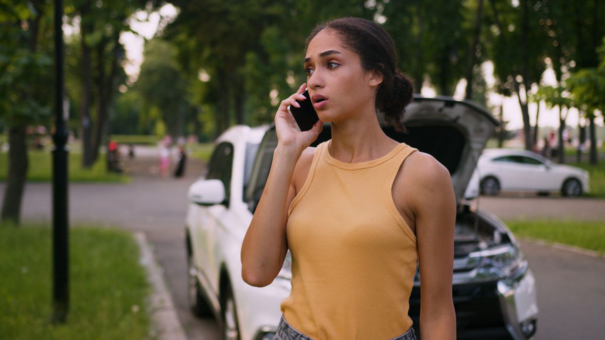 Woman making phone call after accident
