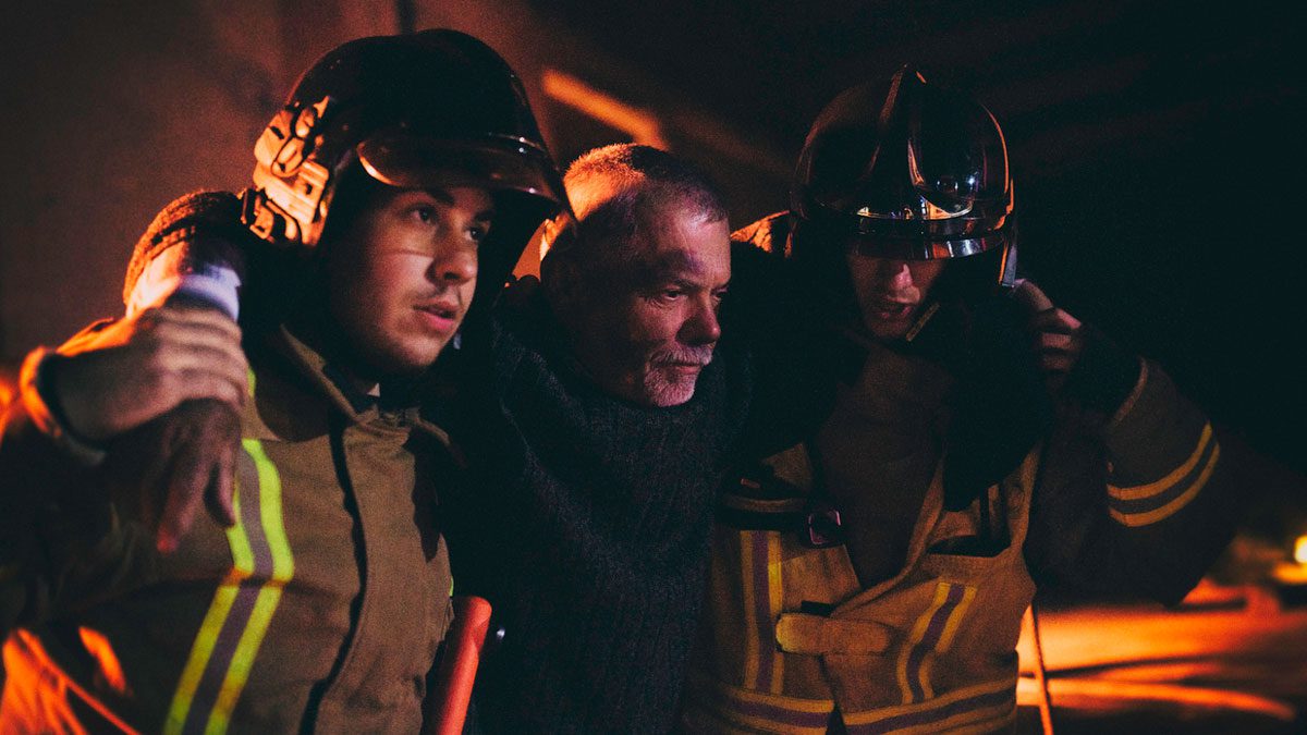 firefighters-helping-a-man-from-a-building