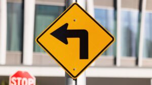 photo-of-yellow-left-turn-sign