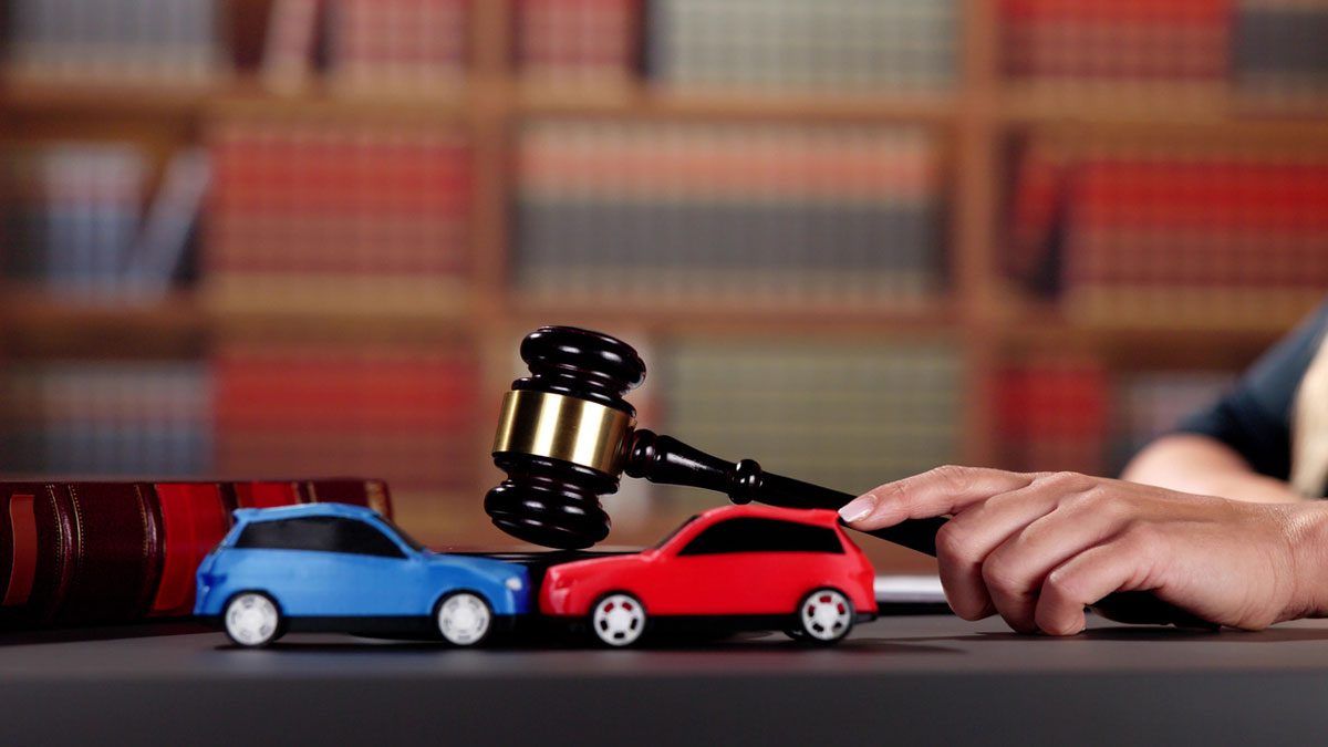 toy-cars-on-desk-with-gavel
