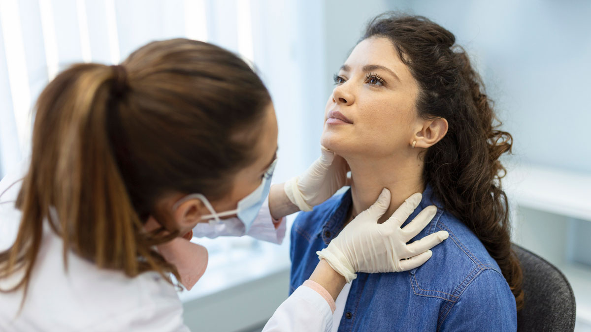 doctor-examining-patients-lymph-nodes