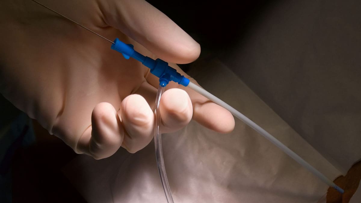 gloved-hand-holding-end-of-port