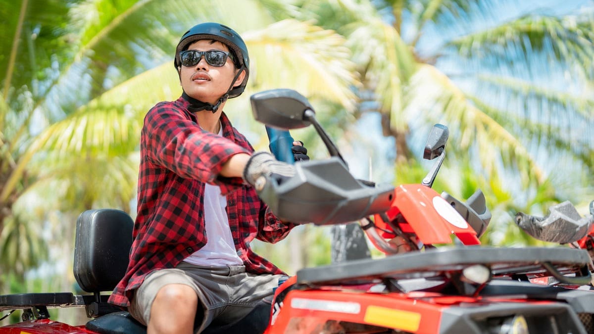 man-with-helmet-on-ATV