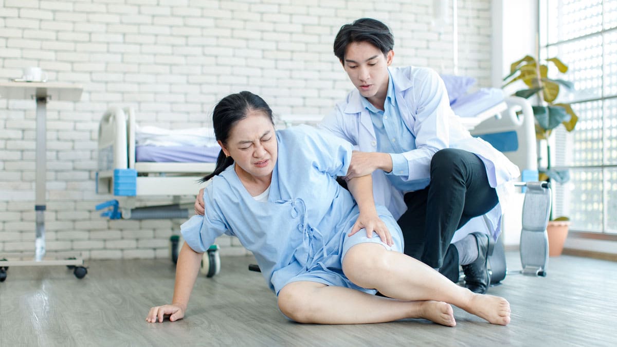 medical-professional-helping-patient-up-after-a-fall
