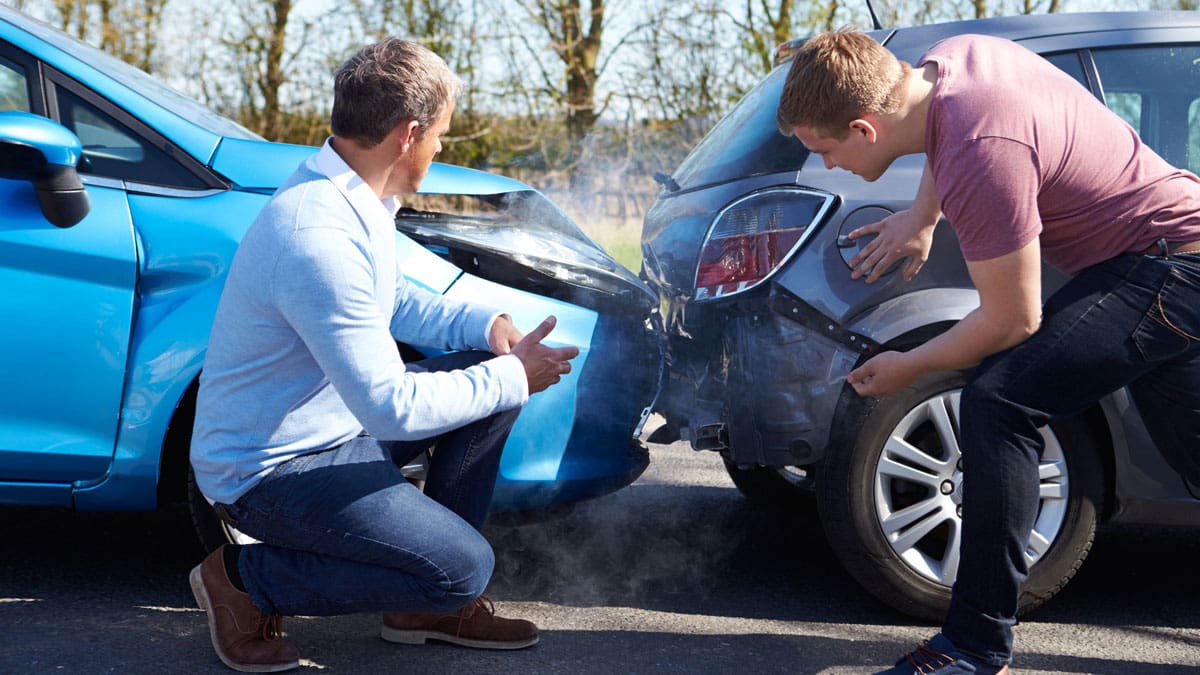 two-drivers-evaluating-cars-for-damage-after-a-crash