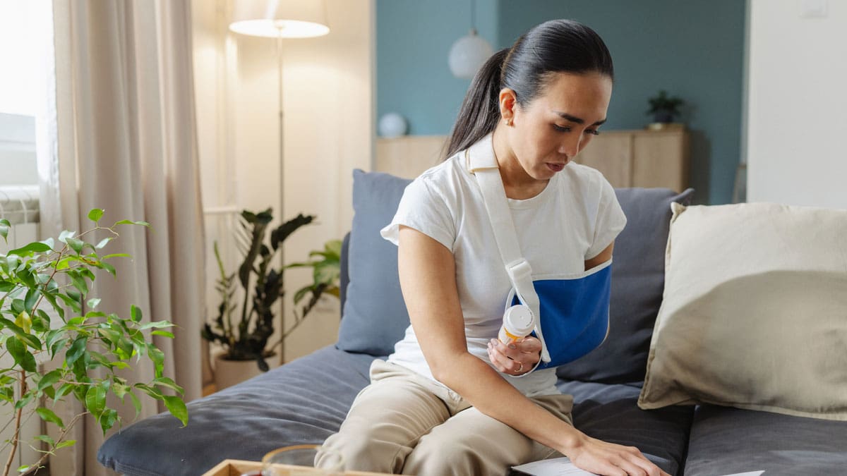woman-with-hurt-arm-reviewing-care-instructions