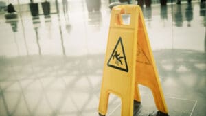 yellow-wet-floor-sign-on-shiny-floor