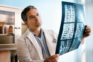 doctor-evaluating-spinal-x-rays