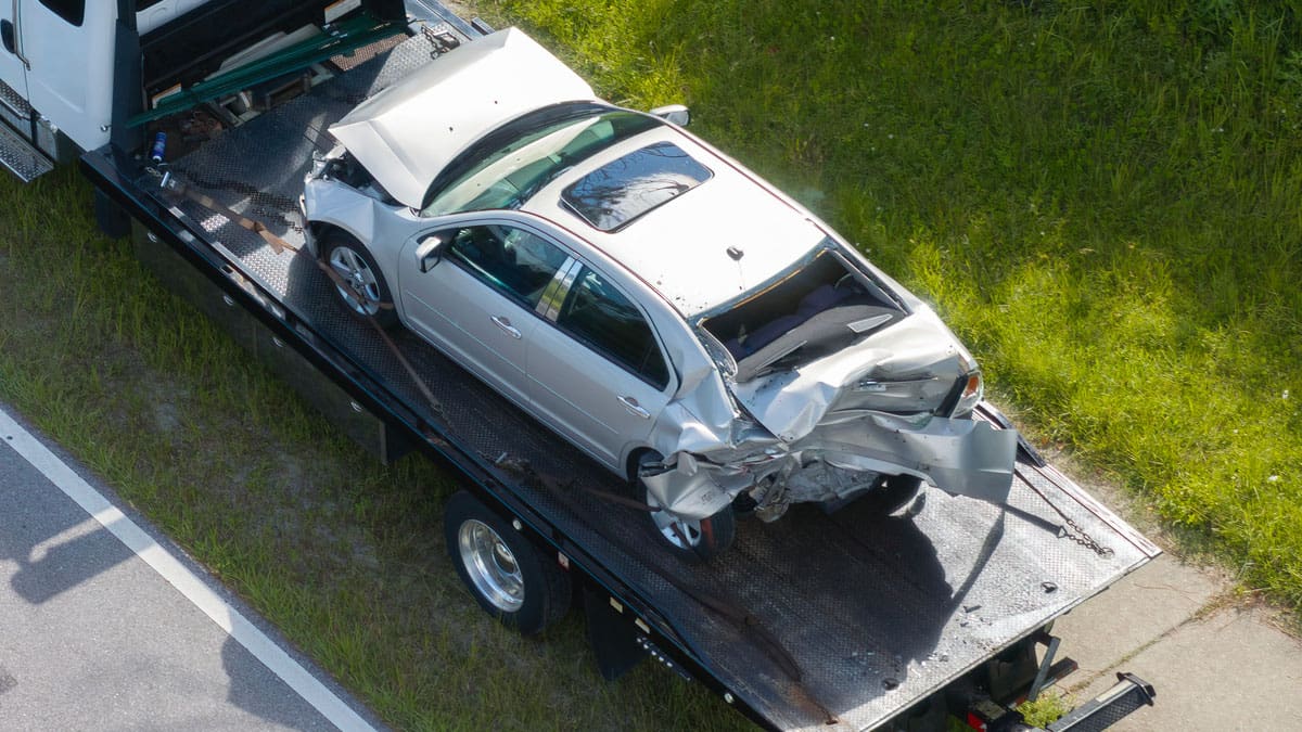 overhead-view-of-car-being-towed-after-accident