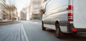 side-rear-view-of-a-delivery-van-on-the-street