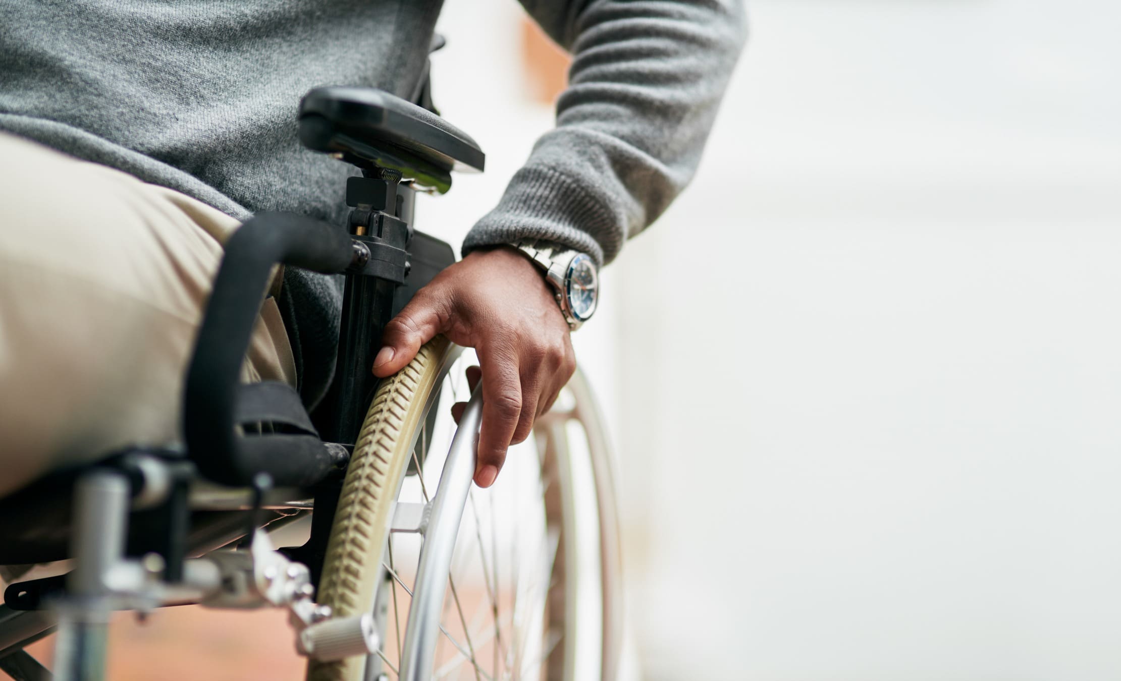 side view of male in wheelchair