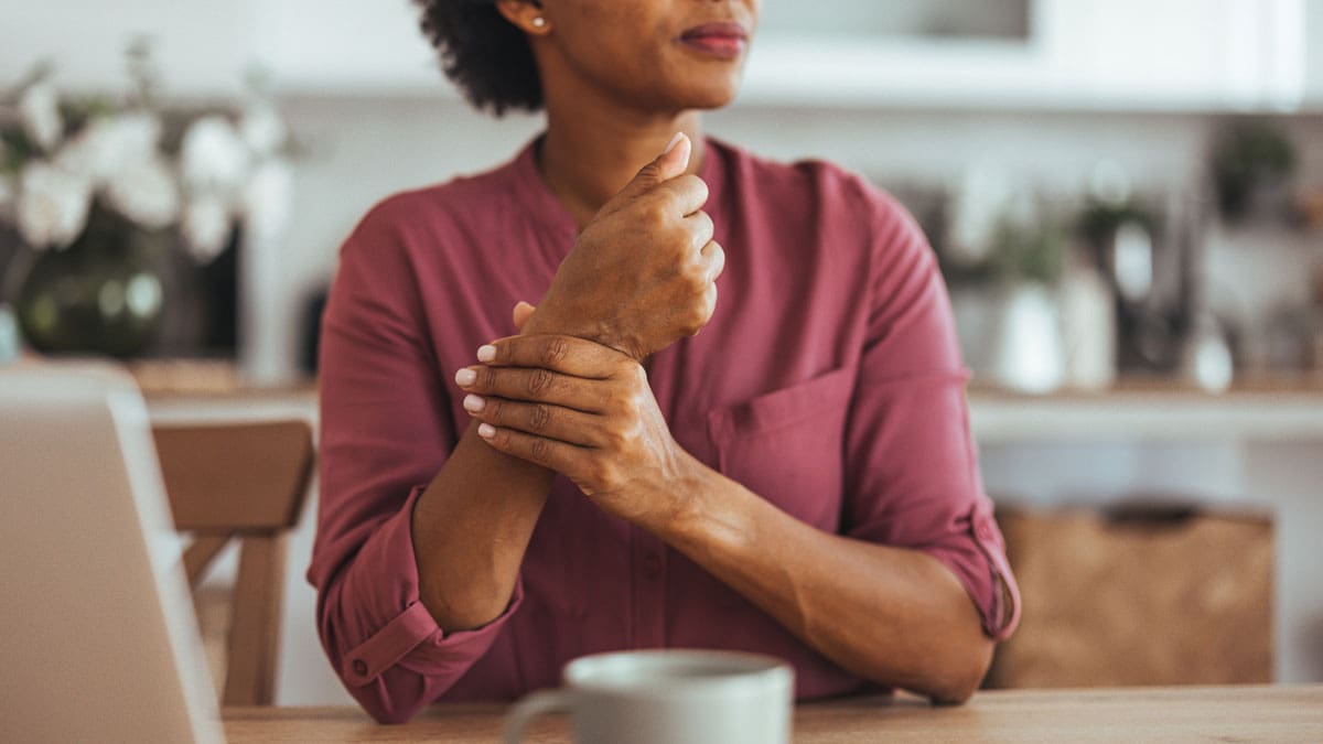woman-holding-wrist-in-pain