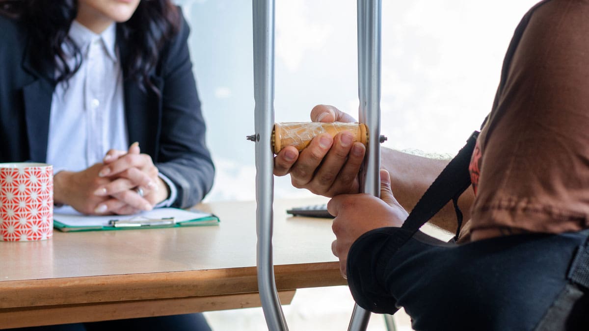 attorney-taking-notes-across-the-table-from-a-client
