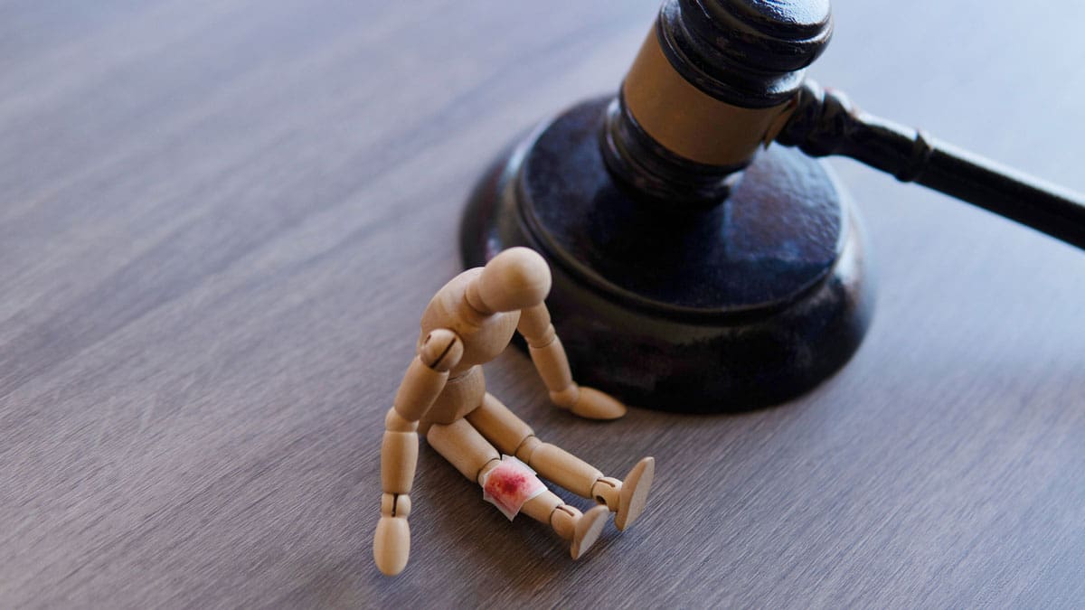 gavel-and-small-wooden-figure-on-a-desk