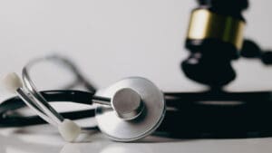 gavel-and-stethoscope-on-a-white-surface