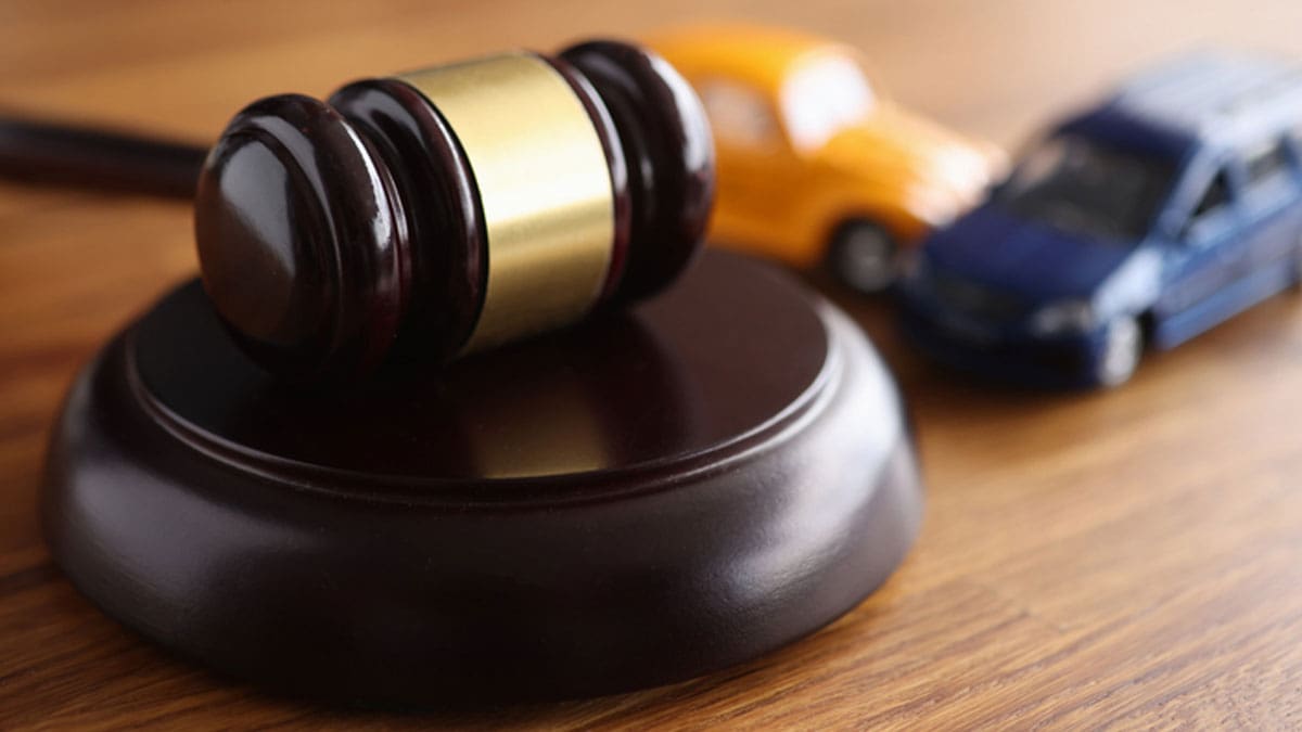 gavel-on-a-desk-next-to-toy-cars