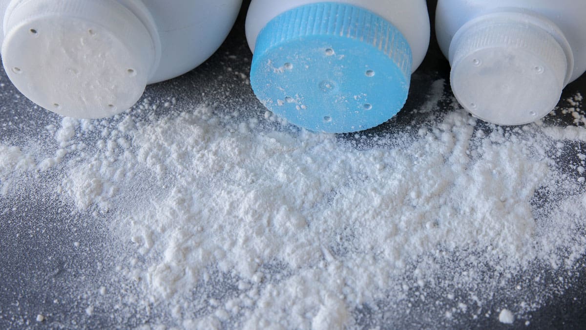 powder-bottles-tipped-over-with-white-powder-spilled-around-them