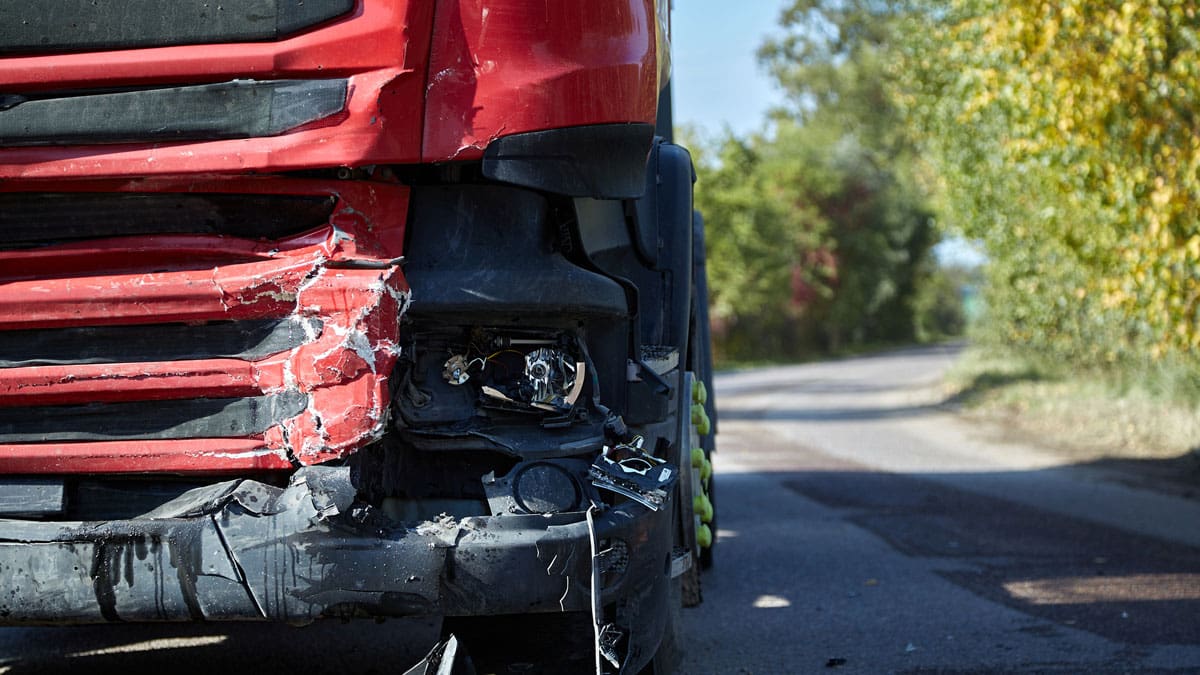 rear-end-damage-on-a-car-stopped-behind-a-truck