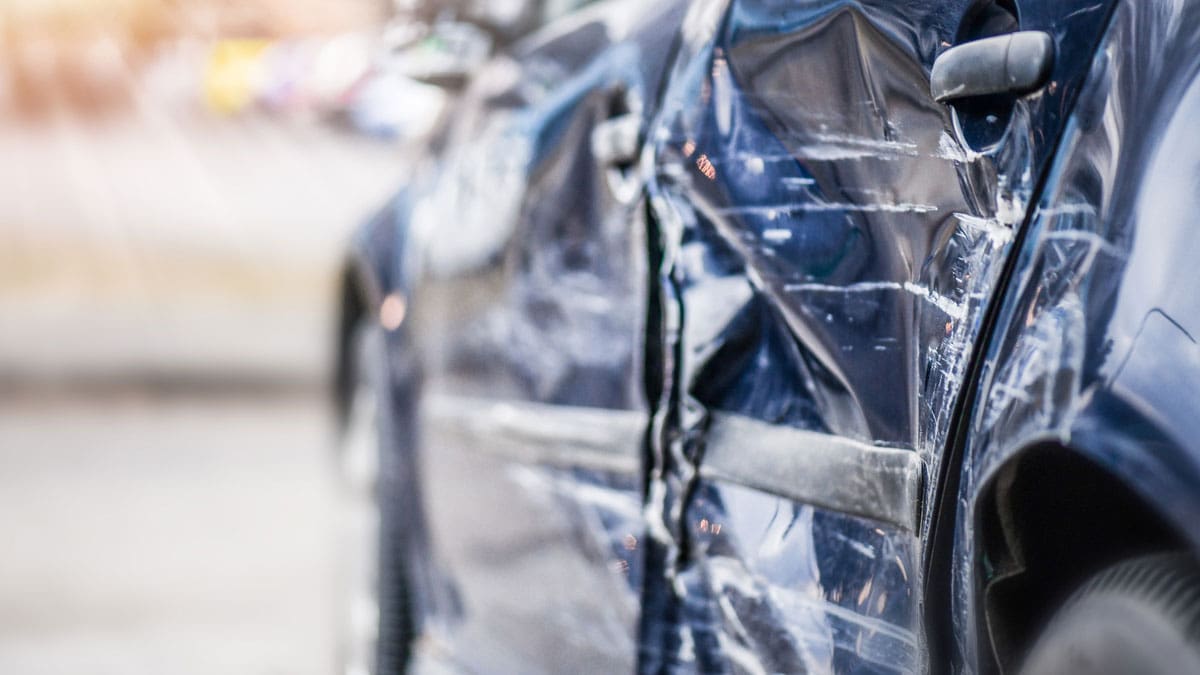 side-view-of-damaged-car-after-crash