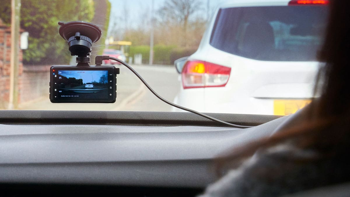 dash-camera-mounted-on-a-car-dashboard-facing-the-road