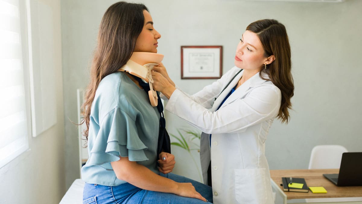 doctor-evaluating-patient-wearing-a-neck-brace