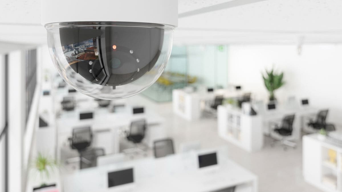 dome-security-camera-mounted-on-an-office-ceiling