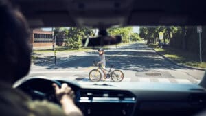 drivers-view-of-a-cyclist-ahead-through-the-windshield