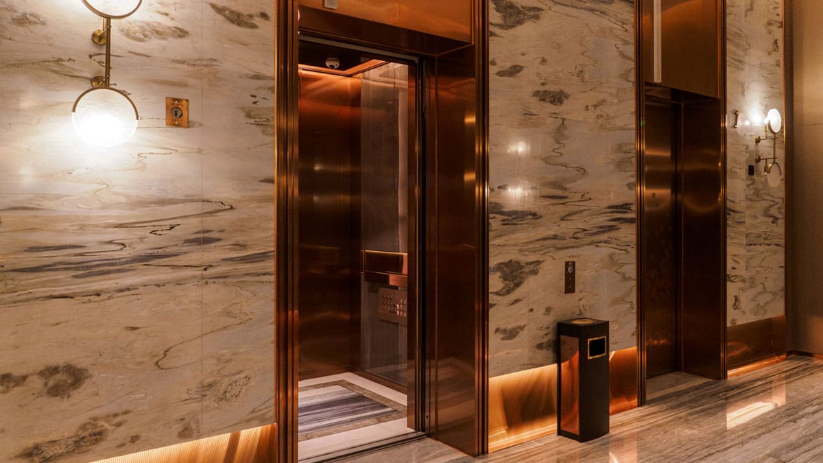 elevator-doors-in-a-marble-building-lobby