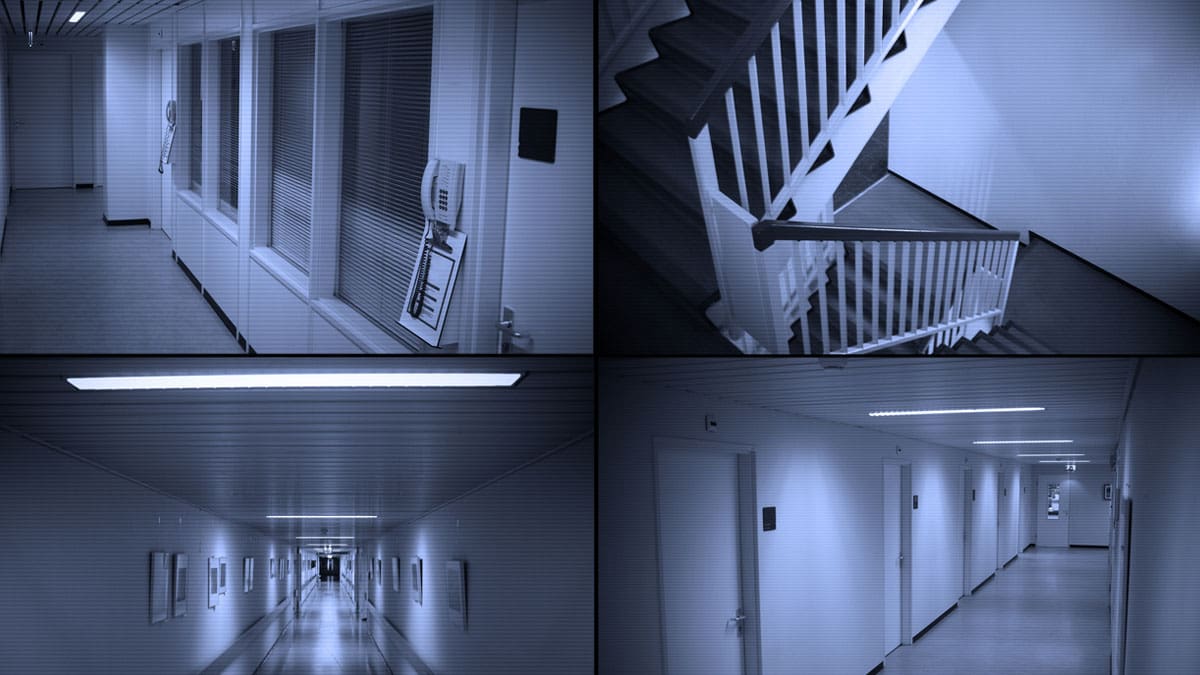 empty-hallway-in-a-building-with-stairs-at-the-end