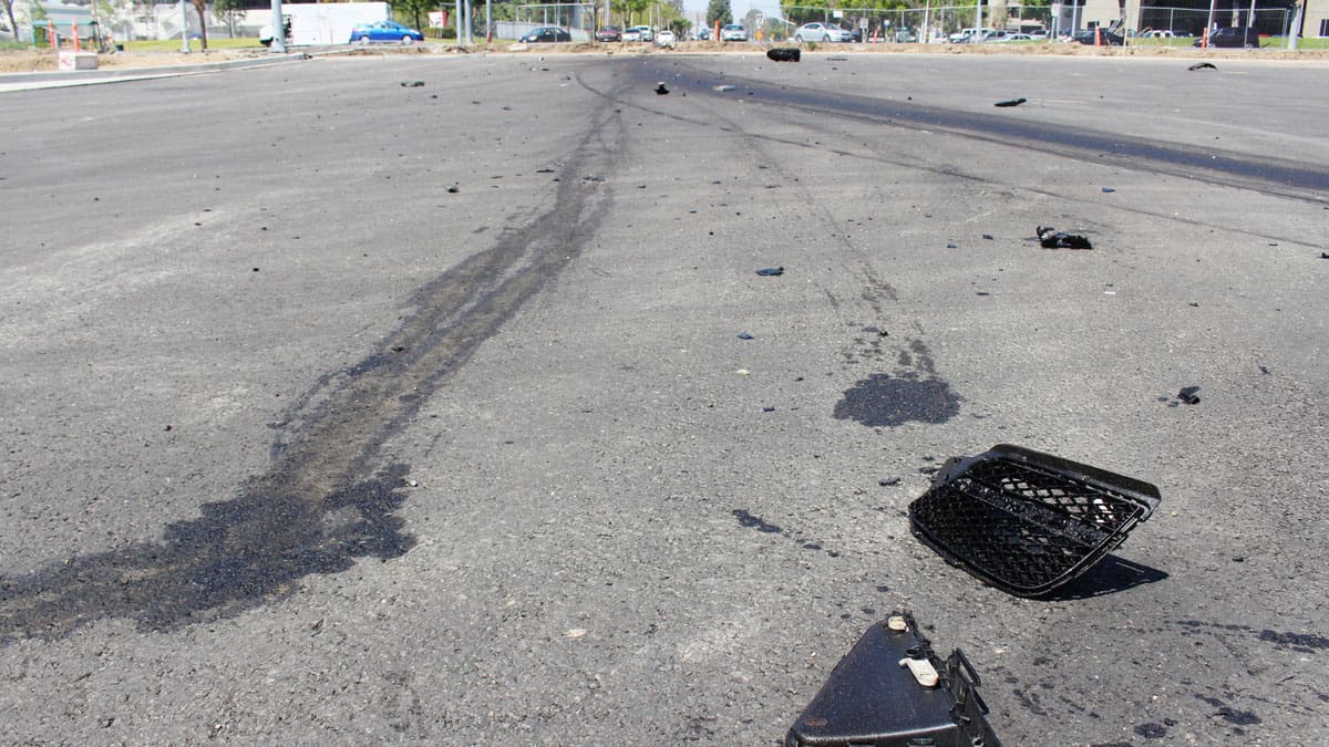 skid-marks-and-debris-scattered-across-a-roadway
