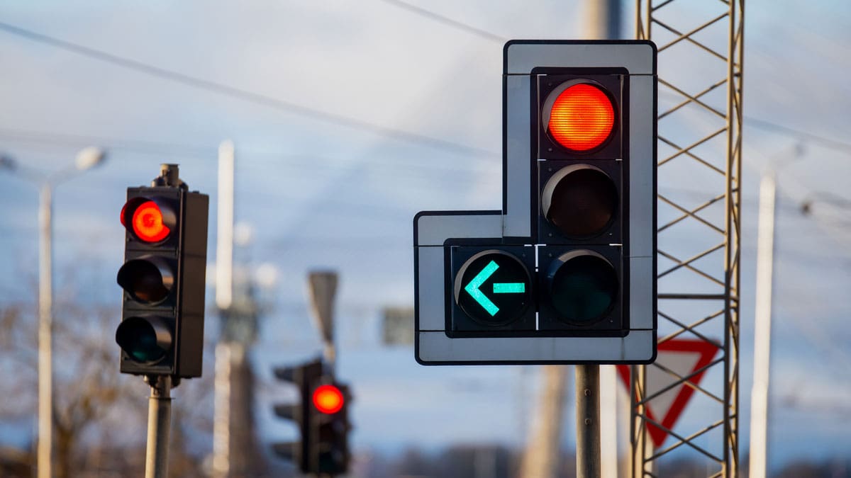 traffic-signals-showing-a-red-light-and-a-green-left-turn-arrow