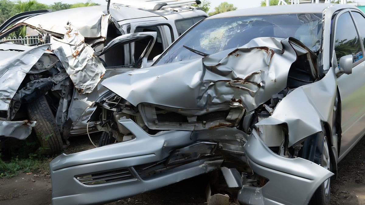 two-heavily-damaged-cars-after-a-front-end-crash